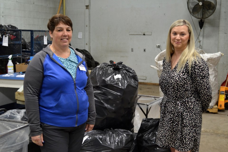 Estevan SARCAN depot manager Connie Hagel, left, and Estevan Diversified Services executive director Trish Salmers saw increased activity in the depot.