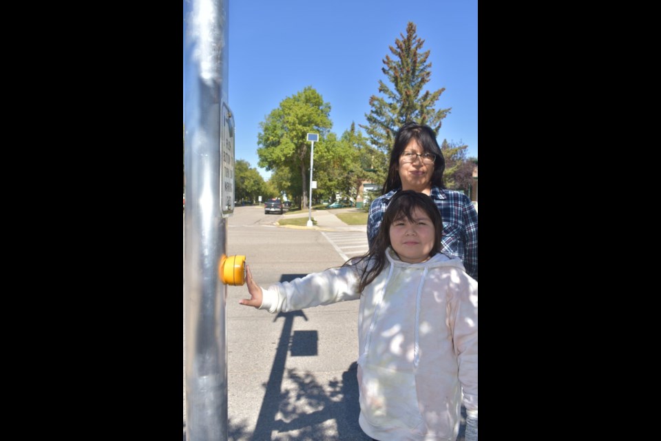 A Town of Kamsack crew was busy last week painting a crosswalk across Queen Elizabeth Boulevard at main street where they had previously installed a new solar-powered, lighted crosswalk sign.