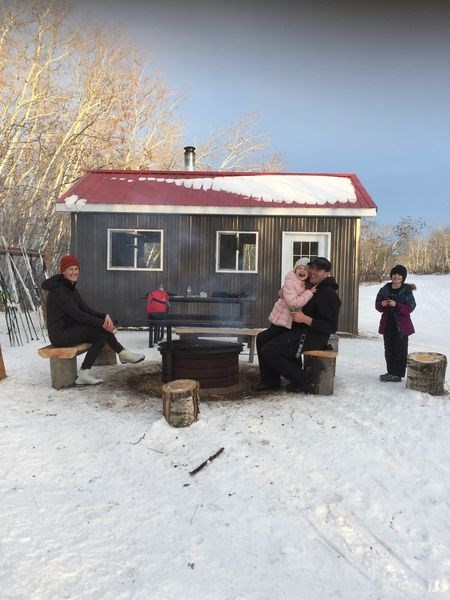 An increasing number of skiers, including the Chad Zavislak family of Canora, have been getting out and enjoying the cross country skiing at Good Spirit Lake Provincial Park this winter. The Zavislak family took a relaxing, scenic break at the new warmup shelter right on the trail. From left, were: Andrea Reynolds, Haley Zavislak, Chad Zavislak and Nina Zavislak.