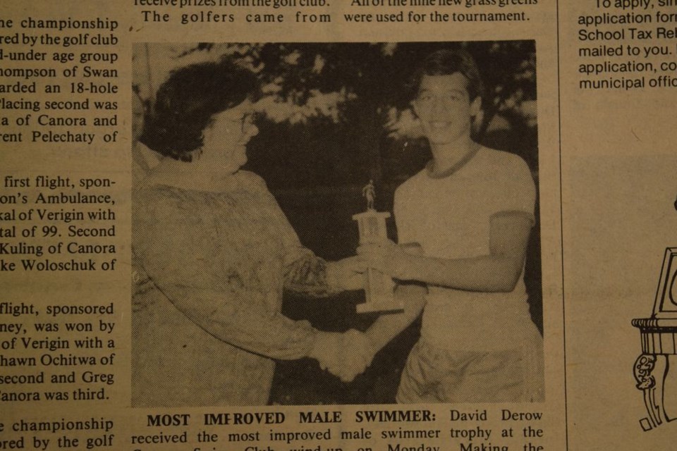 David Derow received the most improved male swimmer trophy at the 1979 Canora Swim Club wind-up. Making the presentation was Anne Wyonzek of Wyonzek Construction of Canora.