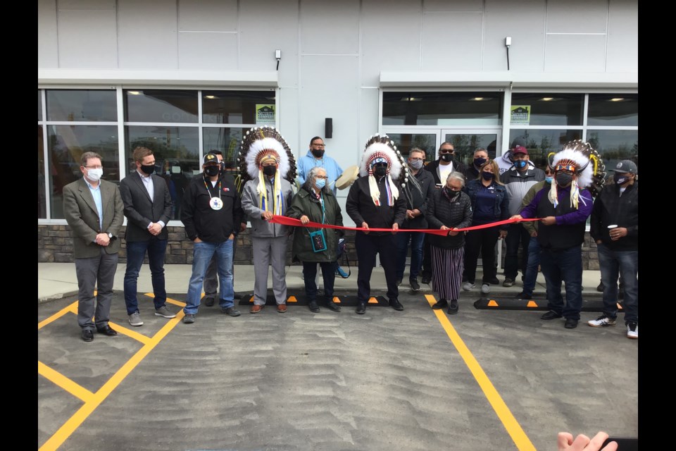 Dignitaries are on hand for the ribbon cutting at the new Red Pheasant Cree Nation Centex Gas Bar and convenience store in North Battleford. Jenny Spyglass had the honours of cutting the red ribbon.