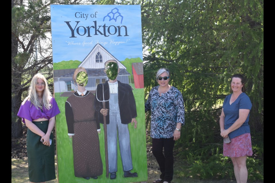 Mya Lauer, Tonya Vermette and Michelle Easton infront of the outdoor photo stand. (Photo by Tanner Wallace-Scribner)