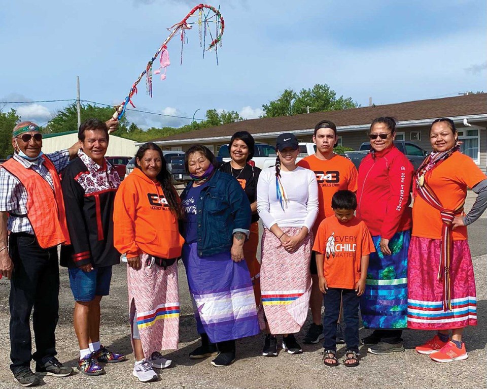 Patricia Ballantyne, third from left, along with supporters, family members and walkers during their