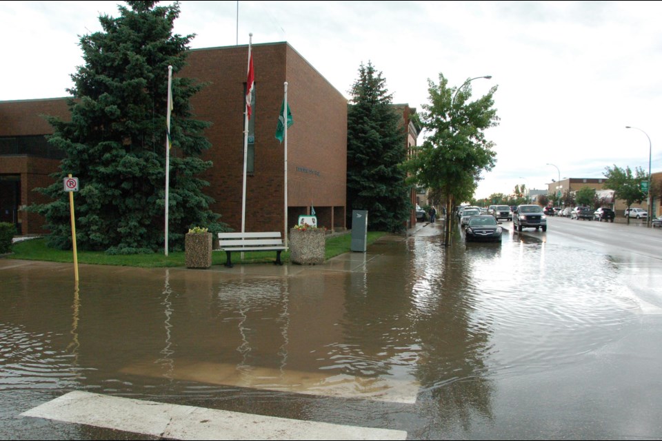 Knee high puddles were formed in front of City Hall.