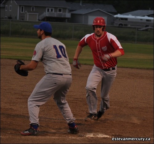 Devin Aspinall goes back to first on a pick-off attempt during the Tower Wolves' 19-4 win over the Lampman Cubs Friday.