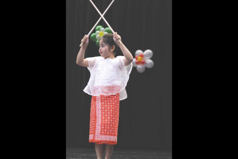 A dancer from the Parkland Filipino Canadian Association participates in a Sakuting dance.