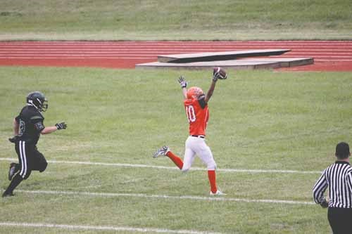 Junior Raider safety Skylar Soldat celebrates his interception touchdown late in the fourth quarter that sealed a Raiders win against the Lumsden Devils.