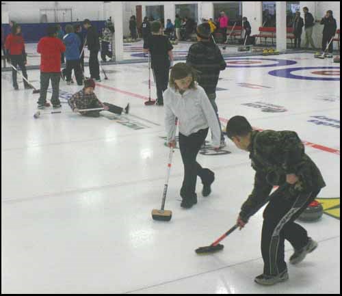 Stephanie Flaman watches as teammate Reese Kinaschuk sweeps.