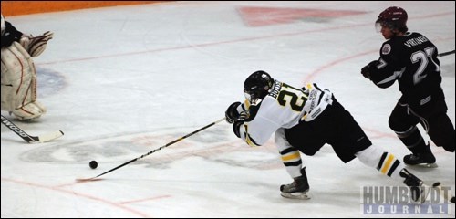 Bronco Justin Buzzeo hardly had control of the puck when he poked it by Flin Flon Bombers goaltender PJ Musico during the first period of their game in Humboldt on December 7.  Buzzeo got the first of Humboldt's five goals that night.