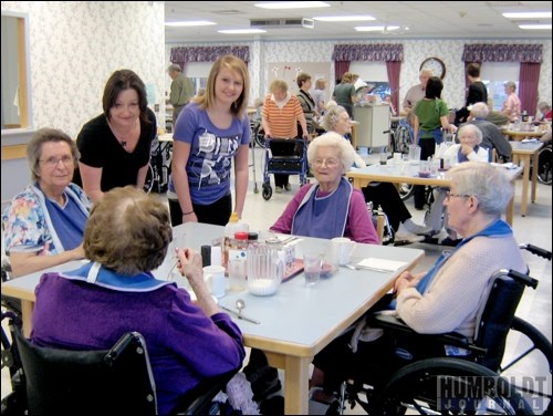 Ashley Salikin helps serve residents during a pancake breakfast at St. Mary's Villa during Take Your Kids to Work Day.  Ashley spent the day learning about what her mother, Linda, does for so many hours a day.