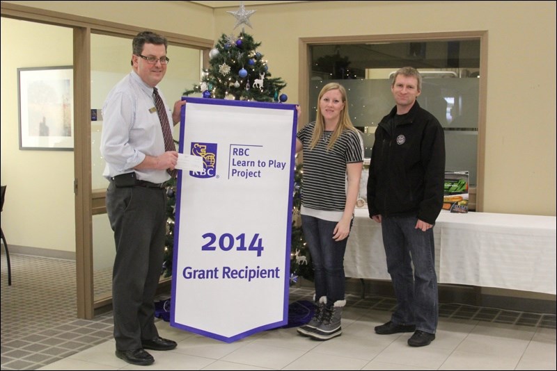 Flin Flon Minor Hockey Association players will be stepping up their skills with help from Royal Bank of Canada. Flin Flon branch manager Michael Yarowy presented volunteer coordinator Carrie Stinton and treasurer Cory Bradt with $3,500 through the RBC Learn to Play Project grant as well as a banner. The funds will go toward the hiring of a power skating coach for all players. “The goal is to encourage more kids to get out and play,” said Yarowy.