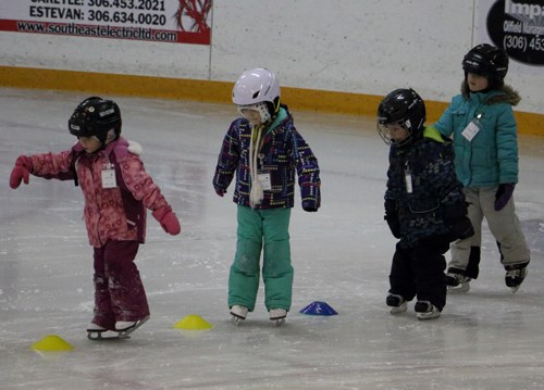 Young skaters weave through pylons during their CanSkate practice as they prepare for their skating carnival in March.