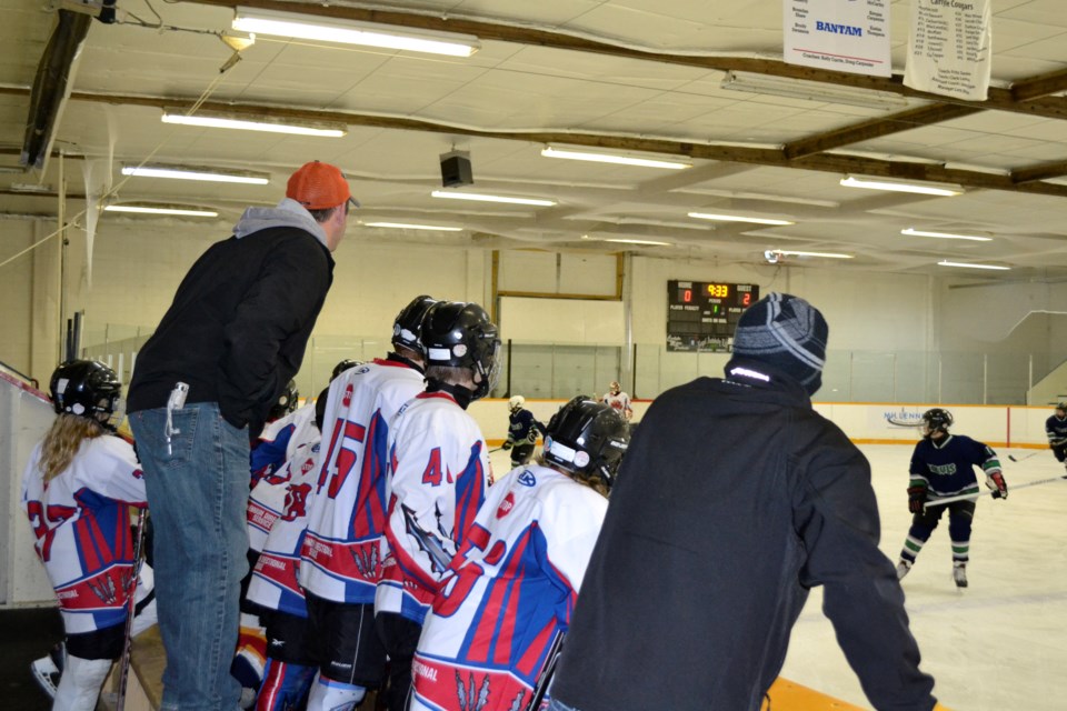 Led by head coach Dwayne Bye and assistant coach Steven Valentine, the Carlyle Cougars Peewees face off against the Redvers Rockets during Minor Hockey Day in Carlyle.