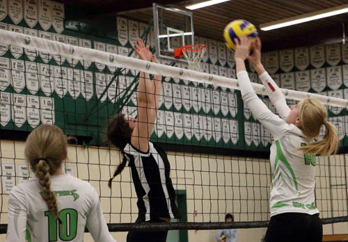 Ashleigh Wolensky of Bellegarde flick blocks the ball down in a match against a Moose Jaw team.