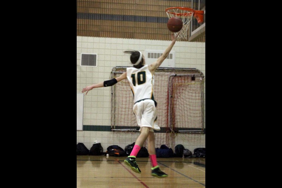 Bryan Buzinski scores two of his 17 points in Sacred Heart’s tournament ending win over Melville on Saturday afternoon at the Halo Dome.