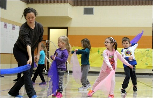 Dancer and educator Ashley Johnson leads Cut Knife pre-kindergarten children through fun physical activity.