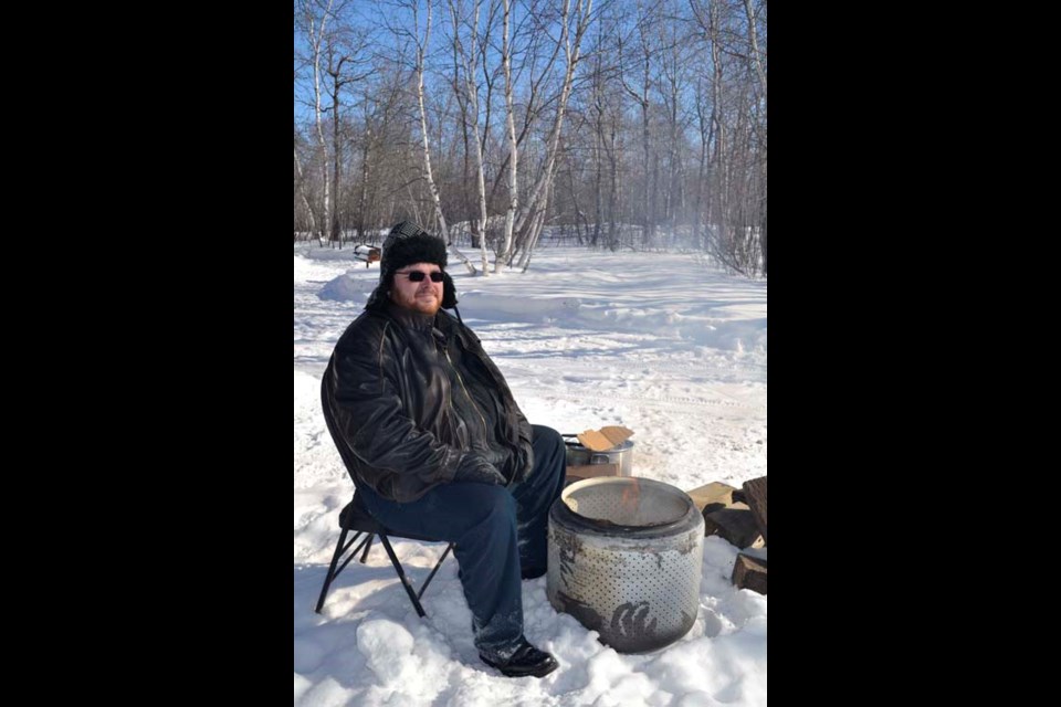 The day-long Winter Fun Day held Saturday, Feb. 21 at Moose Mountain Provincial Park began with a pancake breakfast at the Moose Mountain Church of Christ, while the afternoon's menu featured smokies and fire-roasted hot chocolate. Here Paul Moore, the Church's minister and Moose Mountain Lion's Club member, gets the hot chocolate cooking.