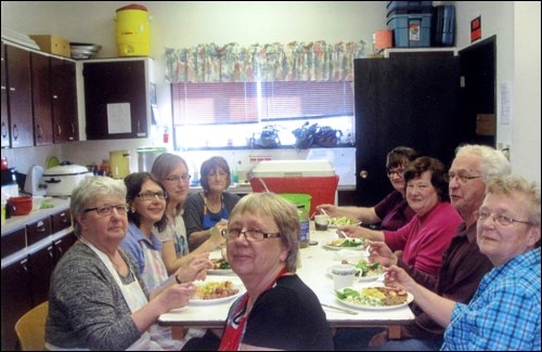 The kitchen crew providing meals for the Old Mills Players’ recent supper threatre performances included: front – Leanne Cherwinski; left to right around the table – Gail Adamus, Maryann Mischuk, Teresa Toews Faye Liebaert, Margaret Adam, Sonia Prescesky, Keith Liebaert and Alice Grigor.