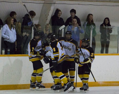 The Arcola/Lampman Imperial Combines celebrate a goal with their fans on Wednesday, March 18.