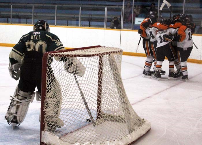 The UCT Terriers celebrate Zach McIntyre’s second goal of the game as Rocky Mountain goaltender Riley Kell digs the puck out of his net.