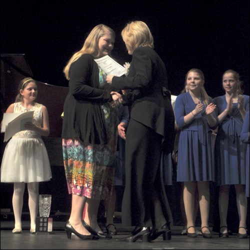 Nicole Klippenstein receives the North Battleford Lions Club Scholarship for promising performer, Intermediate/Senior Vocal from music festival committee chair Dianne Gryba. Nicole has been recommended to the provincial festival for Senior Grade B Female Voice.