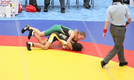 Micheline Biermann takes down the Manitoba 43 kg competitor during the team competition at the Western Games.