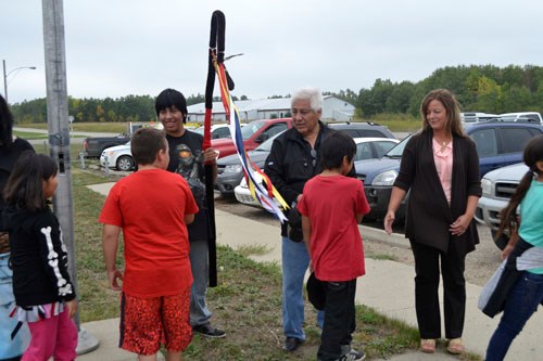 White Bear Education Complex marked the new school year with the school's traditional flag-rasing ceremony on Thurs, Sept. 3. As School Elder Josh Kakakeway (far left) looks on, (l-r) teacher Kevin Kermack and students Tommy Cappo and Tristan Littlechief raise the White Bear First Nations flag, the Treaty Four flag and the White Bear Education Complex school flag, while student Andrew Kakakeway carries the Eagle Staff.