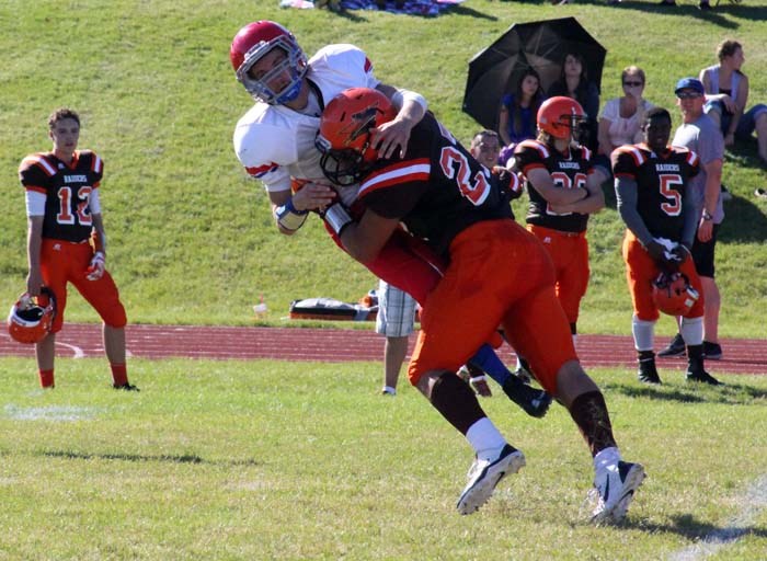 Caleb Bymak, shown here eliminating Swift Current quarterback Dalton Christiansen, had a solid game on both sides of the football. In addition to causing trouble for the Colt offence, Bymak also ran the ball effectively for 70 yards on five carries.