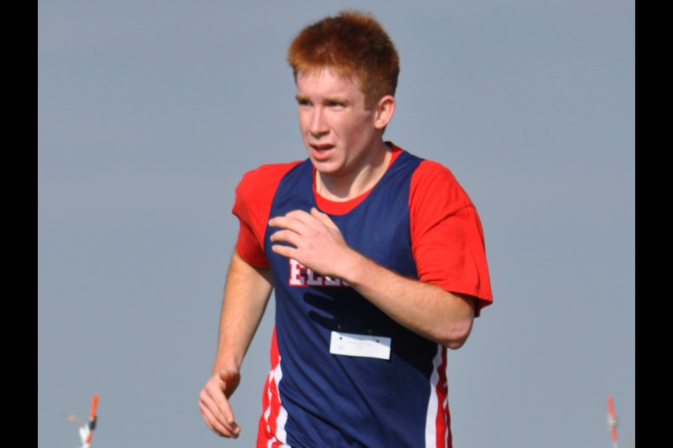 Elecs cross country runner Ethan Courteau competes in the senior boys race at Moose Creek Golf Course last Wednesday during the district competition.