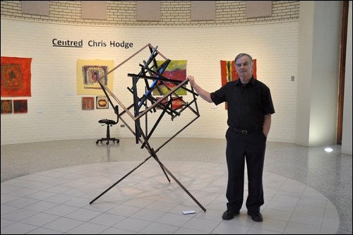 Artist Chris Hodge and his sculpture Scattered. Photos by Jayne Foster