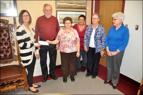 A cheque for $1700 was presented to Nicole Combres of Battlefords Boys and Girls ClubIn the photo are Don Mitchell, Florence Sehn, Gwenda Rondesvedt, Joan Harrison and Peta Ellis.