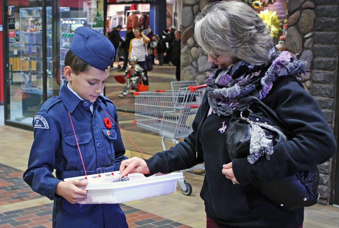 Tag Day Air cadet Caleb Liebrecht sells poppies at Parkland Mall during the official launch of the Royal Canadian Legion’s 2015 Poppy Campaign. Funds from the campaign are dedicated to helping local veterans, seniors and the community at large. Last year’s campaign raised more than $35,000.