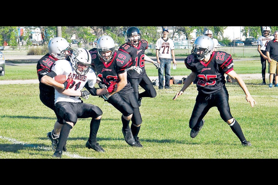 Ethan St. Mars was on the tackle while Glen Teslia (19), Derek Barteski (25) and Bryce McCormick (16) were close behind.