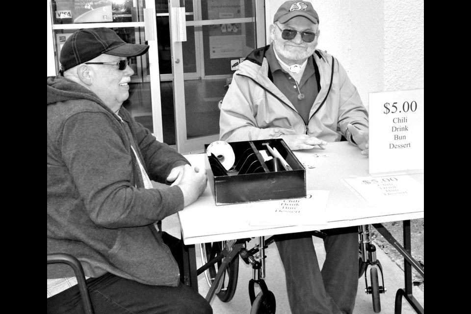 Les Deacon-Rogers, a CIBC staff member, and Ken Wasyliw, a volunteer, were in charge of selling tickets for the chili lunch for the CIBC Run for the Cure fundraiser on Thursday. A total of 157 persons were served.