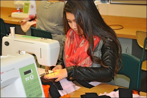 Julissa Martinez, who came to Canada from Honduras four years ago, says she hasn't done anything like quilting before. Photos by Jayne Foster