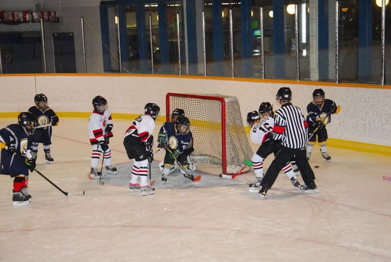 Winning by a score of 24-2 over the Cote Novice Chiefs on Sunday, members of the Canora Novice Red team spent a lot of time face to face with the Chiefs’ goalie. The Canora players in this photo were: Gabrielle Marcischuk-Butler in front of the net with Alaina Roebuck on the side.