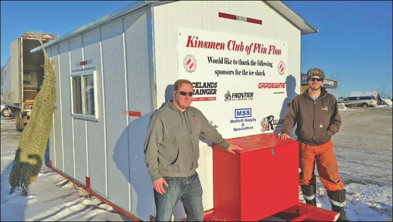 Tim Babcock (left) and Paul Harrison of the Flin Flon Kinsmen Club stand with the high-end ice shack the club is raffling off later this month. The shack took 60 man-hours to build and is valued at $2,800. Tickets are available at various locations. The draw will take place on Dec. 29. The raffle is one of the club’s major yearly fundraisers.