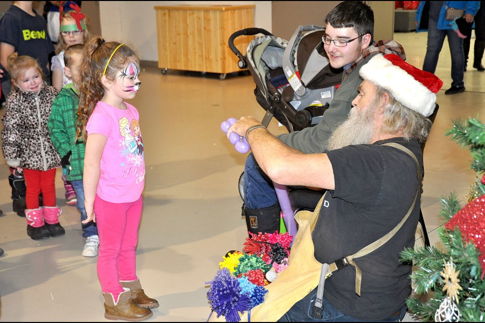 Larry the Balloon Man was on site creating popular balloon animals for the youngsters.Elliott and Odin Hull had a great time doing crafts at Prairie Christmas Family Day.