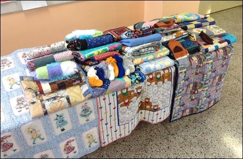 Rivers’ Edge Quilt Guild members have created comfort quilts to be donated charity groups, including the Empty Stocking Fund. Photos submitted