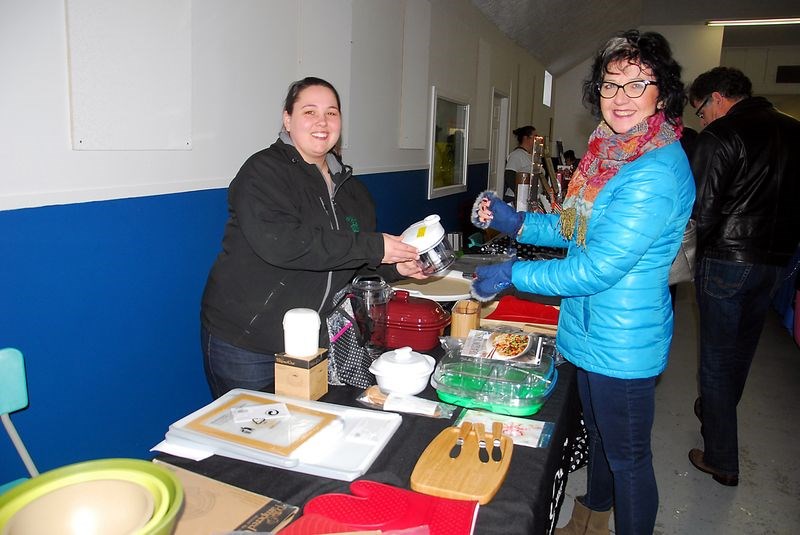 Gina Rakochy (right) was learning about The Pampered Chef products from Kim Onufreychuk of Yorkton at the Christmas Mini Market on Sunday.