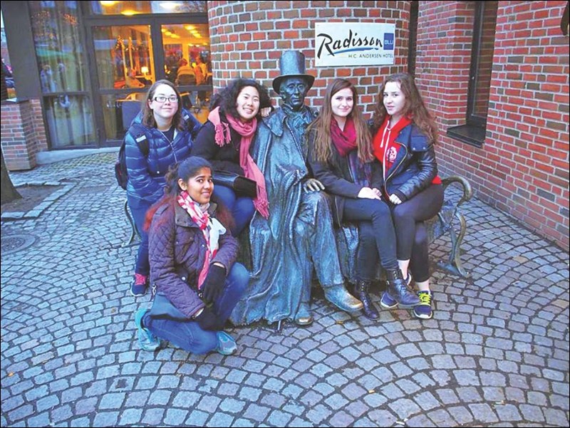 Roxann Mousseau (far right) posed for a picture with friends from Japan, Alberta, India and the US alongside a statue of beloved Danish writer Hans Christian Andersen, in Odense, Denmark, where the writer once lived.