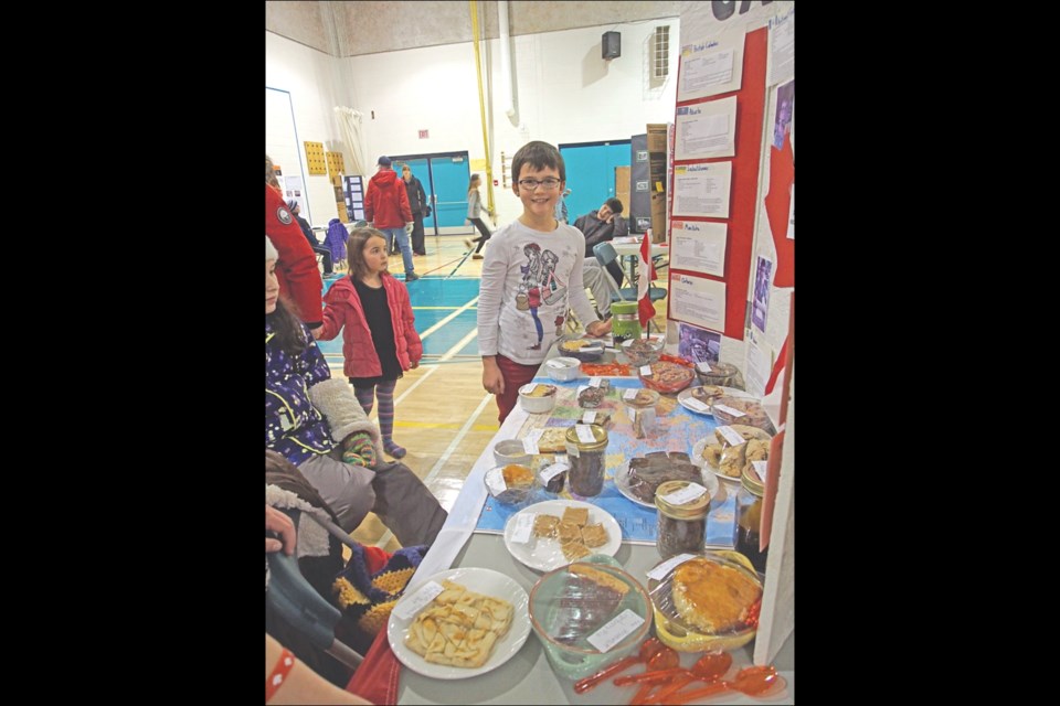 Grade 4 student Isabel Plamondon studied unique Canadian desserts and pastries. For her exhibit, she baked samples, such as PEI potato chocolate cake and Yukon bushberry cake, for the judges to taste.