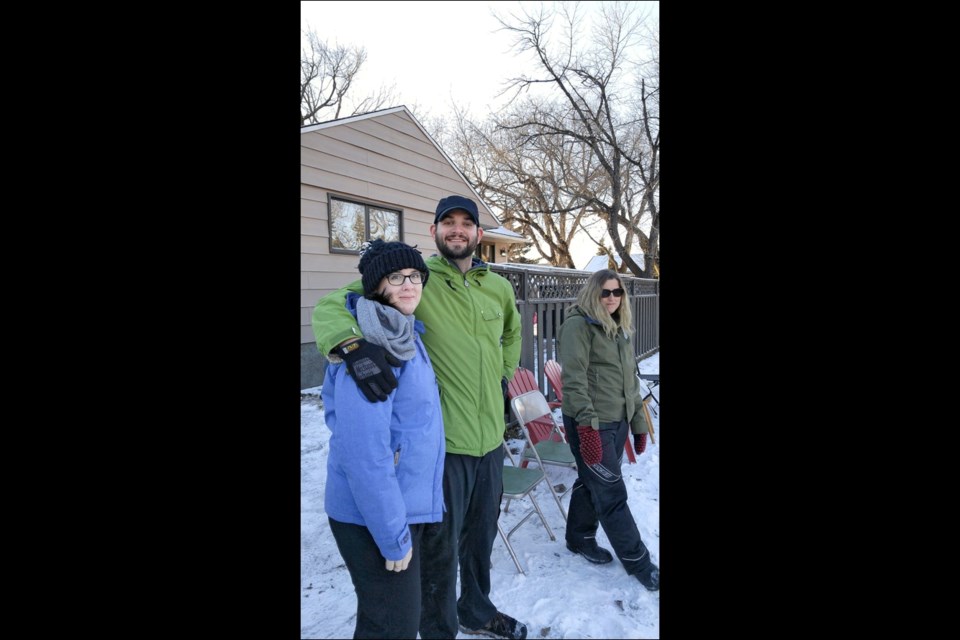 Good Old-Fashioned Fun — A block street hockey game was hosted before Christmas by Neil and Megan Georget on 94th Street. Flyers were delivered in the surrounding area. The entry fee was a food donation for The Lighthouse. Hot chocolate and squares were served. A bonfire was lit for heat and toasting marshmallows. Just under 50 people came and had great fun getting to know neighbours and enjoying an old-fashioned game of hockey.  Photos submitted