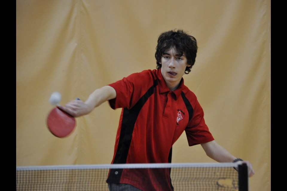 ECS table tennis player Kevin Sylvestre returns a shot during the Table Tennis Saskatchewan tournament at the school on Saturday.