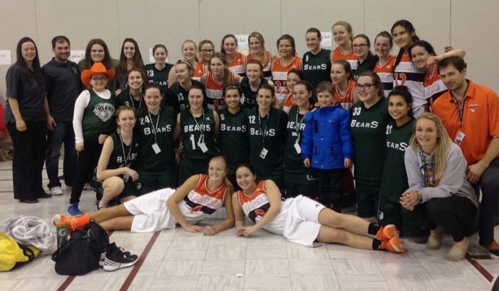 The YRHS Lady Raiders pose for a photo with the Breton Education Centre Lady Bears - the host team that the Raiders played twice and ended up billeting with during their stay in Nova Scotia.