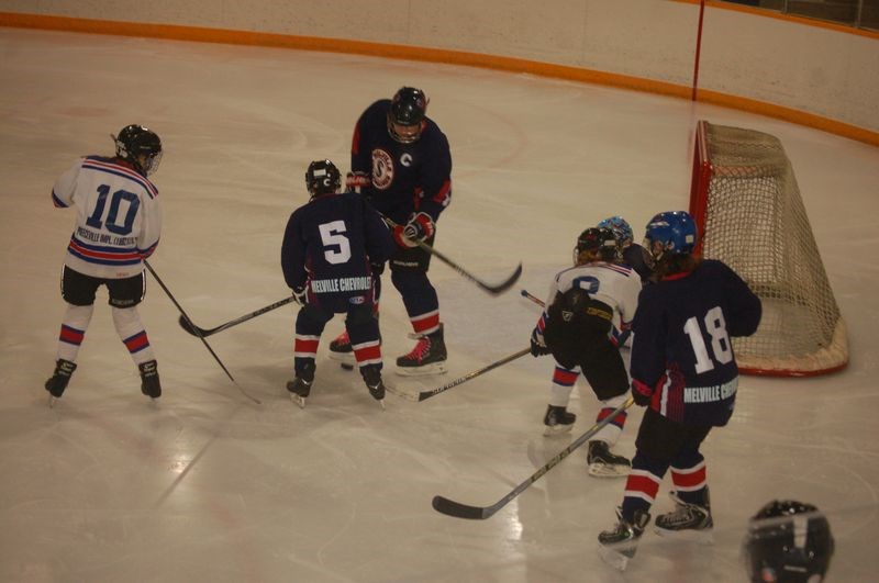 Brynn Babiuk, left, and Trever Geistlinger teamed up for a shot on net during the Preeceville peewee home game on January 23.