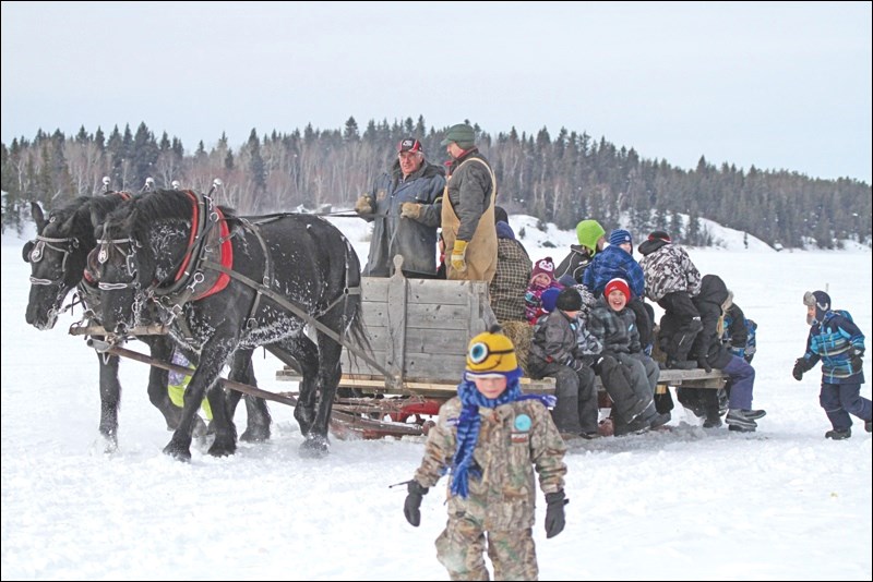 Families flocked to Angell’s marina to enjoy a horse-drawn sleigh ride on Saturday afternoon.