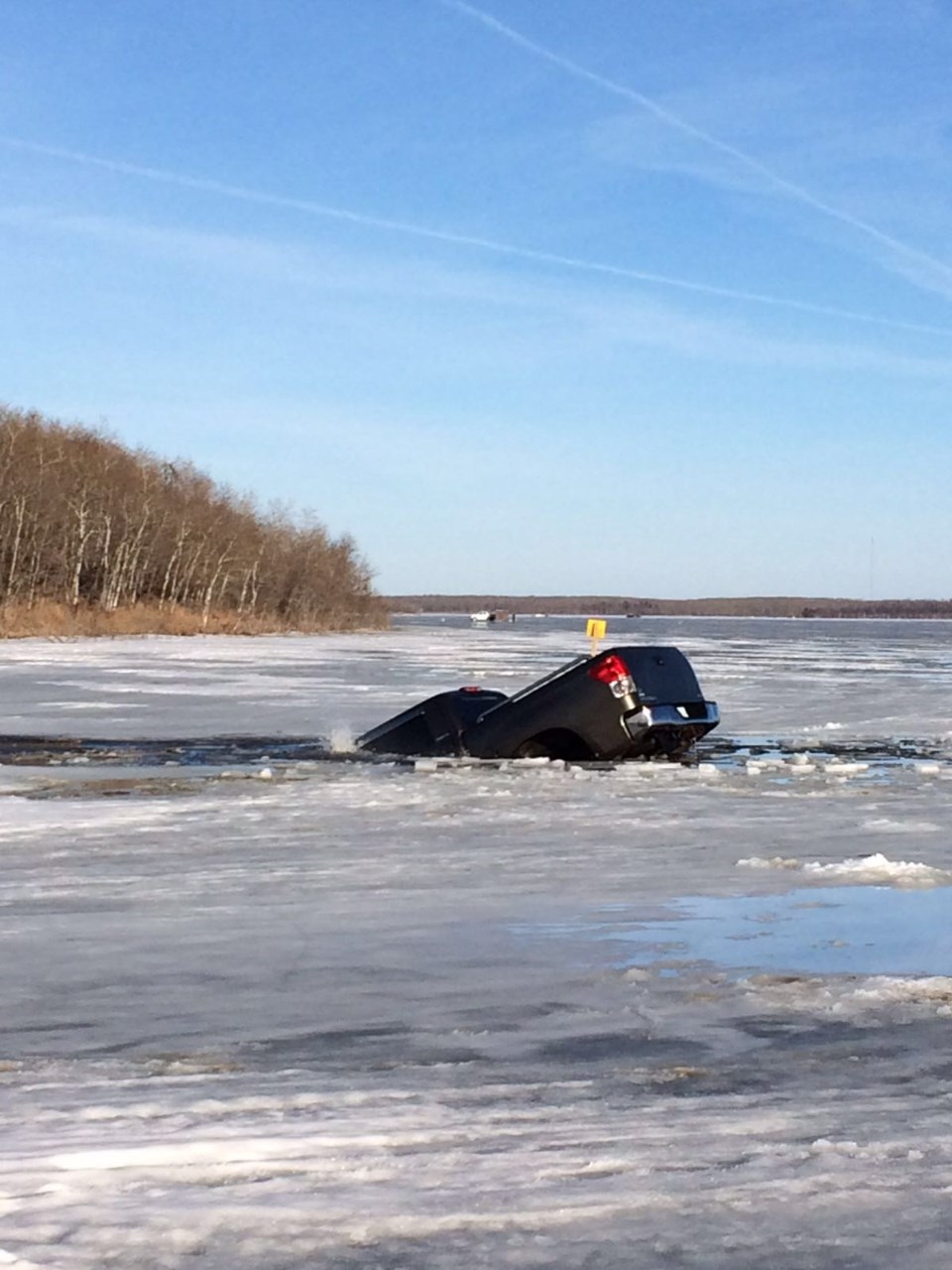 Truck through ice at Kenosee