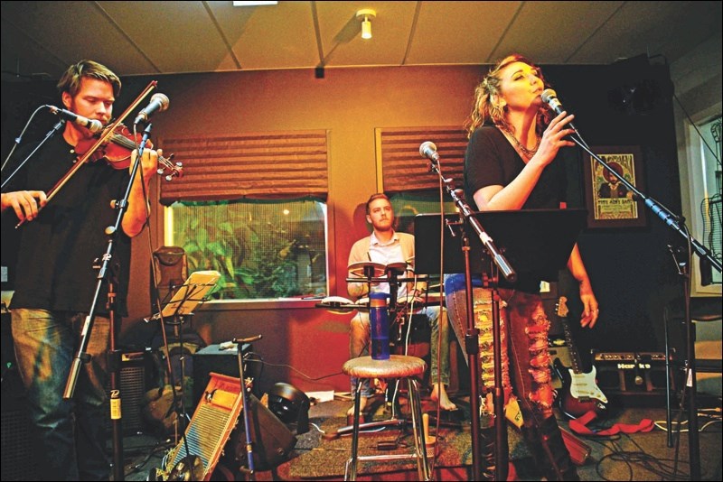 Local songstress Jen McLean lit up the stage with violinist Booker Blakely, with Mark Kolt on piano (not pictured) and Craig Bancroft on drums.