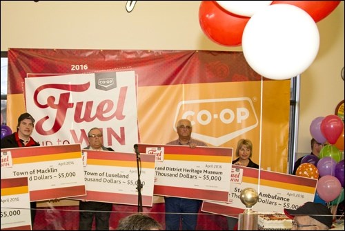 Five Wilkie and area organizations shared in the $25,000 charity portion of Jeffrey Allen’s major Fuel Up to Win prize. Representatives were on hand Tuesday to accept their $5,000 donations. Photos by James Herrick